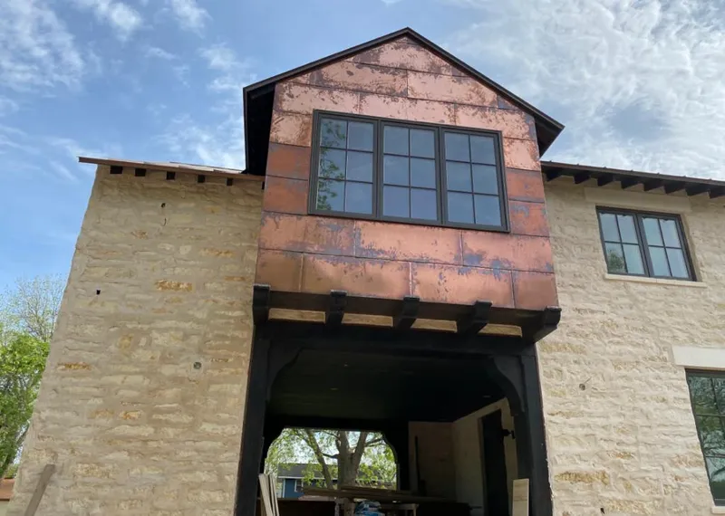 Copper metal panel facade on a stone building for Skylight Installation in Rolling Hills Estates